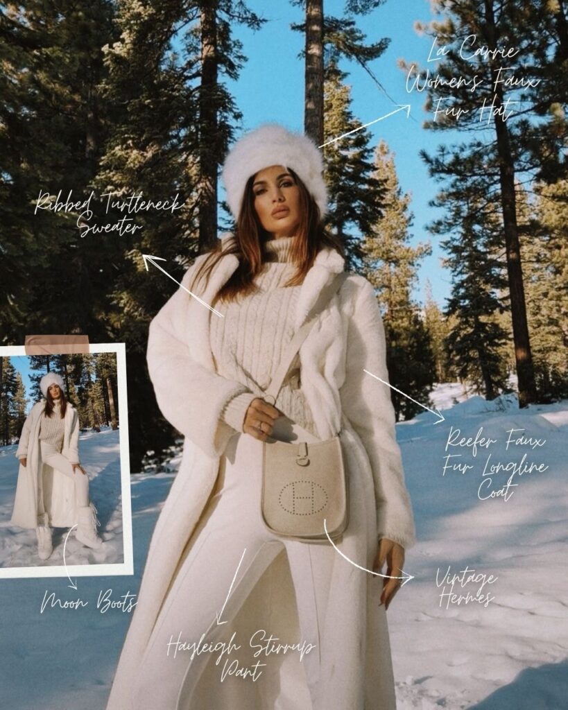 Misha Skova standing in snowy forest wearing a La Carrie white faux fur hat, Nili Lotan ribbed turtleneck sweater, Reefer long faux fur coat, white Hayleigh stirrup pants, moon boots, and carrying a Hermes beige vintage crossbody bag. Outfit details are labeled on image.
