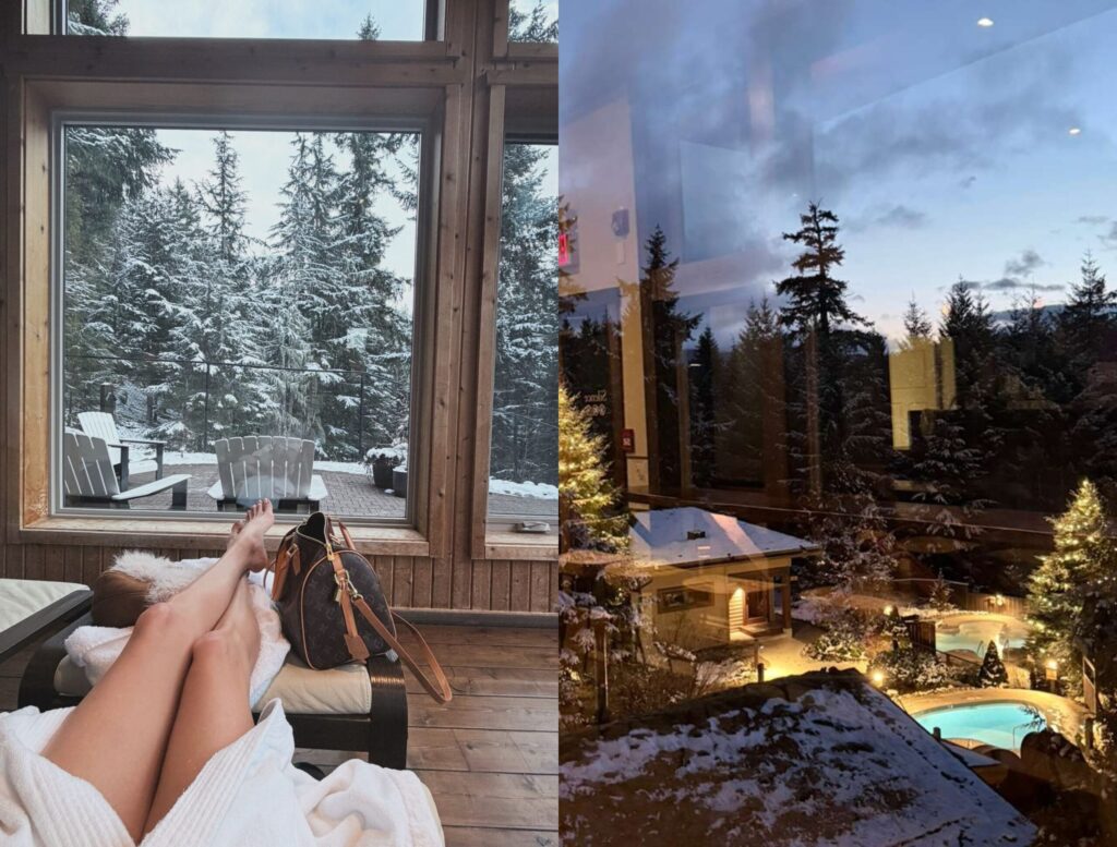 Misha in a white robe relaxes indoors with legs stretched out, looking through large windows at a snowy outdoor scene with trees and a deck. The image also shows a cozy, snowy outdoor area at dusk with lights and a pool.