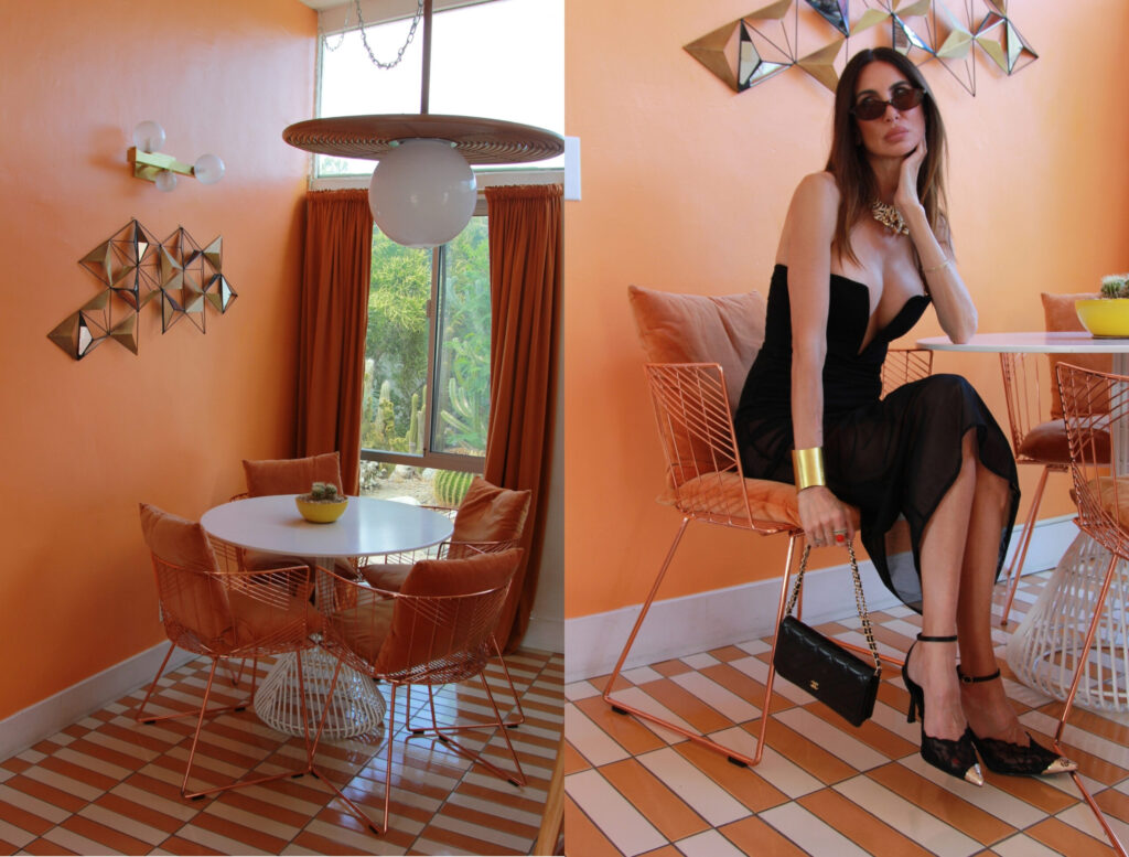 Woman wearing a black summer outfit in a colorful Palm Springs dining room
