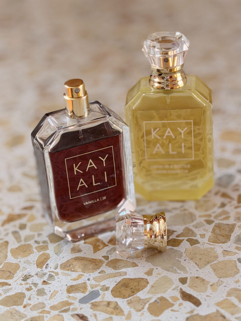 KAYALI Capri in a Bottle Lemon Sugar 14 and Vanilla 28 perfumes styled together