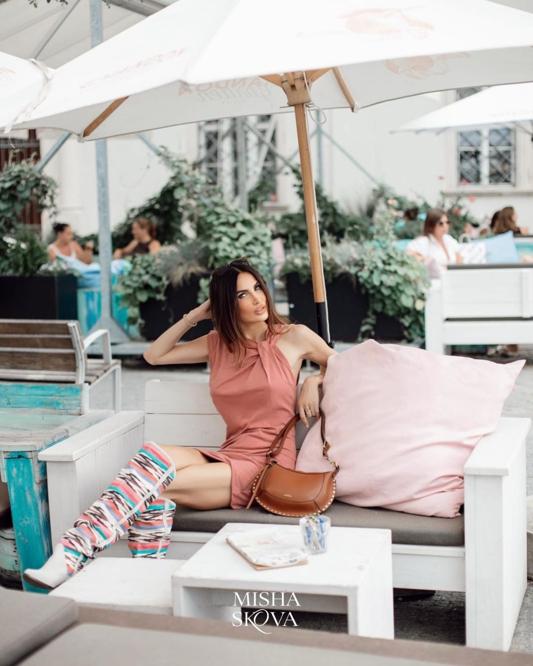 Misha Skova wearing an Isabel Marant outfit at an outdoor café in Brno